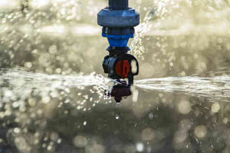 Close up of Nelson Irrigation's A3030 Accelerator with Maroon Plate, Uni-Flo regulator and 1 1b. zinc weight