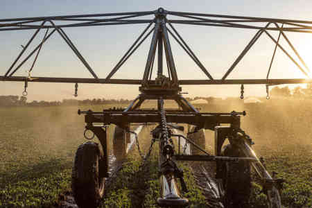 Irrigation booms with Nelson Part Circle Rotators irrigating a farm in Holland